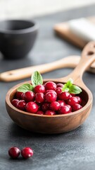 Cranberries cooked in a skillet with spices, showcasing a flavorful dish.