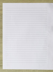 Fototapeta premium Blank Lined Paper on Wooden Surface Background
