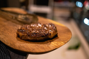 Grilled steak on a wooden slice of wood on a transparent background. 