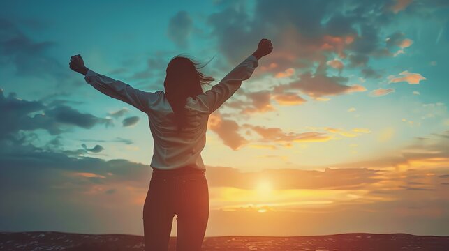 Confident successful woman celebrating achievement with arms raised in a motivational and inspirational setting, symbolizing empowerment and personal growth.
