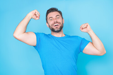 Fototapeta premium Amazed excited man. Close up portrait of handsome man with excited face expression. Hispanic man with excited face. Omg surprise or wow concept. Satisfied middle aged man celebrating success.