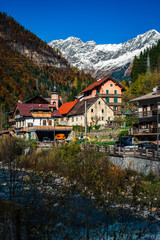 Autumn light on the Carnic Alps. Monte Coglians, Forni Avoltri and its colorful woods