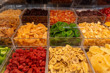 Colorful assortment of dried fruits and vegetables at a local market stall in autumn