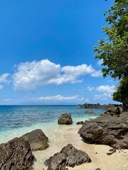a truly refreshing view on the blue coastline with beautiful sea rocks and blue skies in eastern Indonesia