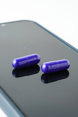 Two medicine capsule pills, supplement isolated on with background