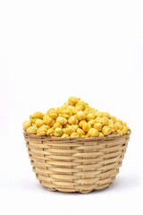 Garbanzo Bean or Chickpea in a Bamboo Basket Isolated on White Background with Copy Space, Also Known as Bengal Gram or Egyptian Pea in Vertical Orientation