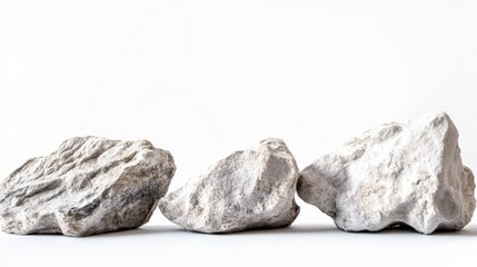 Naklejka premium rocks stones standing alone against a pure white background.