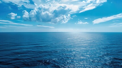 Obraz premium View of the ocean from elevated point with blue sky and sea background