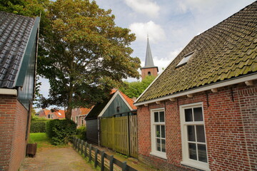 Traditional houses in the village Mitselwier (or Metslawier), Friesland, Netherlands, with the...