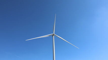 wind turbine on blue sky background © DO 