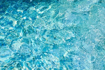 Fresh water pool texture isolated on horizontal ratio blue floor tile background.