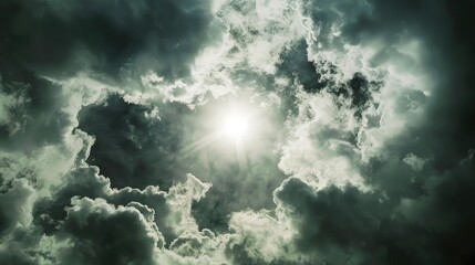 Fototapeta premium Sun seen through dark clouds