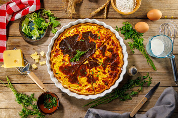 Traditional quiche lorraine with a golden crust and creamy filling. Perfect for showcasing classic French cuisine