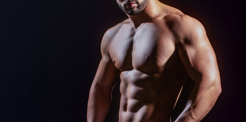 Muscled male torso with abs Six pack. Perfect abs, shoulders, and chest. Close up the Abs. Closeup...