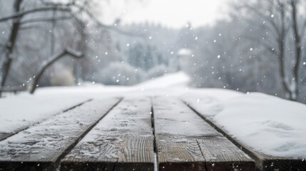 Snowy winter scenery with wooden table