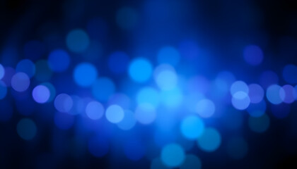 Blurred abstract blue bokeh background with defocused lights and stars for new year or Christmas lights background.