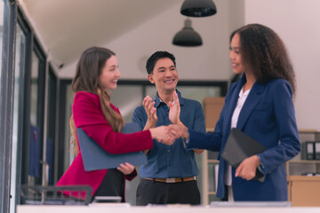 Business team shaking hands celebrating success Applause and shaking hands celebrating success in business deal Business people presenting their business start-up project together