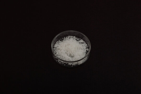 Magnesium nitrate powder in Petri dish. Nitromagnesite, hexahydrate. Saltpeter. Fertilizer used for fertilizing garden, horticultural, floral and decorative and coniferous crops