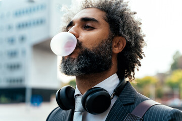 Young entrepreneur chewing fruit bubble gum