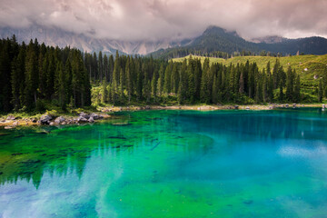 Lago di Carezza, the lake of 1.000 colours, in Dolomites. 