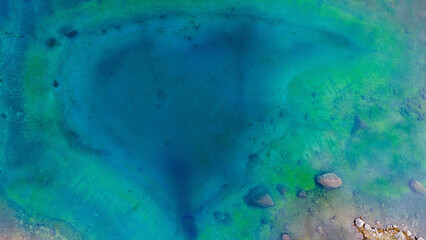 Aerial view of Lago di Carezza, the lake of 1.000 colours, in Dolomites. 