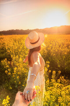 wonam with hat in field