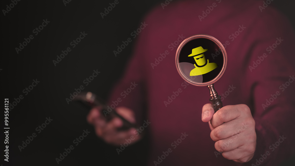 Poster Person holds a magnifying glass displaying a detective icon while using a smartphone. Concept of symbolizes online privacy, security, and cyber investigation.
