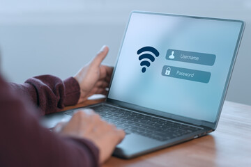 Person logs into a laptop using a Wi-Fi connection, entering a username and password. Technology concept of emphasizes internet access, online security, and personal data protection.