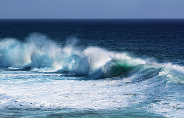 Coastal seascape with powerful waves crashing against the shore