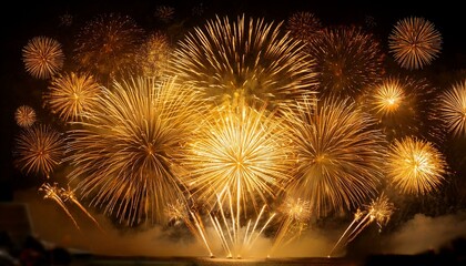 Naklejka premium Golden Fireworks Lighting Up the Night Sky Over a River