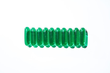 Vitamin E softgel capsules, vitamin D3, fish oil, omega 3, Green oil pills on a white background