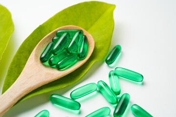 Softgels green, supplements, fish oil, omega 3, vitamin D3, vitamin E oil filled capsules
