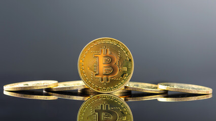 Bitcoin on dark background, Close up golden bitcoin a digital currency, operates on a decentralized system with transactions recorded and new units created without central authority
