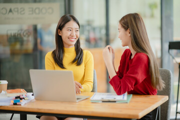 Asian businessman sitting and talking, working at the office