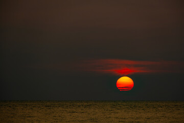 Nature of the beach and sea Summer with sunshine, sandy beaches, clear blue waters sparkling against the sunset sky. On an island with good ecology and environment Background for summer vacation conce
