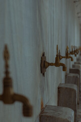 The taps where Muslims do their ablutions for prayers in the Blue Mosque in Istanbul 