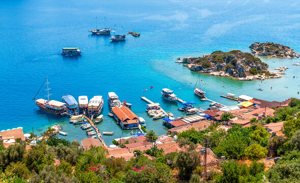 View over Kalekoy village and ruins of the Simena castle, with Kekova island across the water, in Antalya province of Turkey.