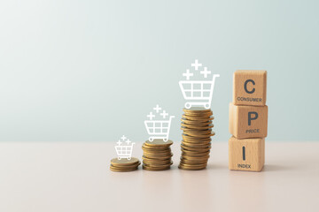 CPI, consumer price index concept. Wooden block with CPI word and stack of coins and shopping cart icon. Goods price inflation and inflation rising. Impact on economic growth