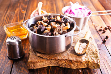 marinated mushrooms in metal bowl