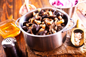 Fototapeta premium marinated mushrooms in metal bowl