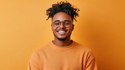 Fototapeta premium Smiling Young Man on Orange Background