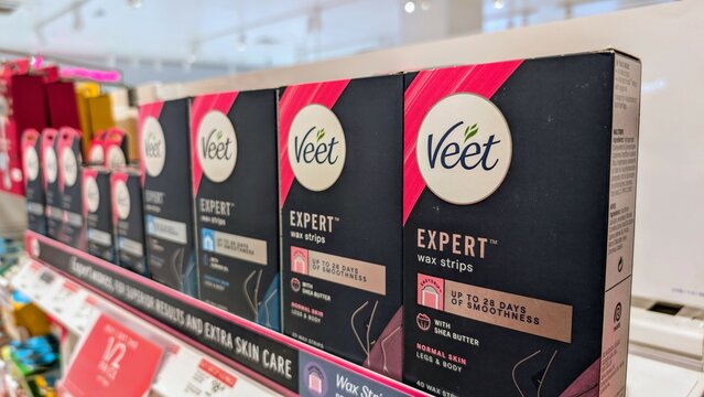 Cosmetics and care products brands displayed on shop shelf in pharmacy store, Galway, Ireland