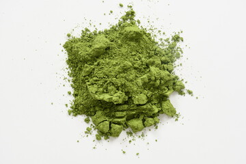 Pile of green matcha powder isolated on white, top view