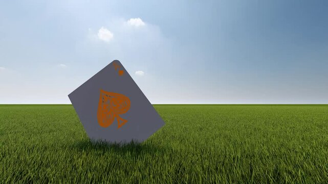 spades poker card on grassfield falling