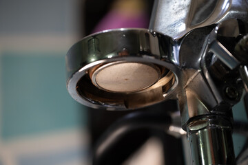 This series of close-up images showcases the intricate details of a professional espresso machine, capturing the essence of a barista's craft. 