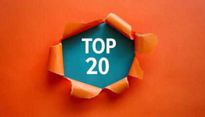 Torn paper revealing text Top 20, bright background. Business concept