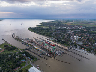 Aerial drone image of the lock complex sluice and Elbe port of Brunsbüttel under construction, the...