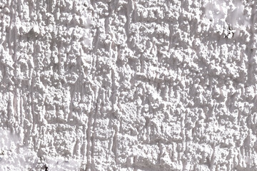 pattern of white painted plaster wall