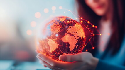 Woman holding a glowing globe of Earth with network lines