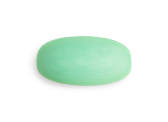 Elevated top view of single dry hygienic handmade natural antibacterial soap bar of green colour isolated on white background used as toiletries cosmetics for skin and body care for bath and shower